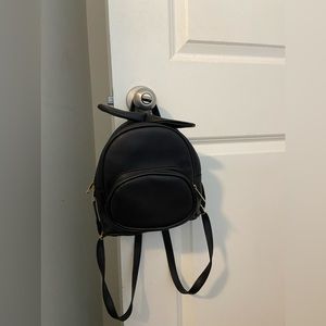 Black book bag with bow